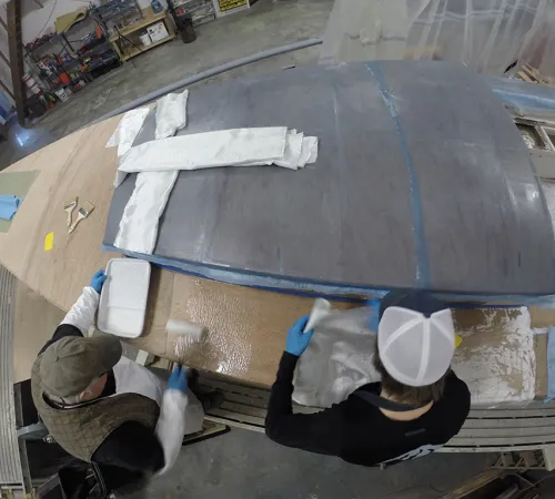 Restoring Vela: Episode 6 – Fiberglassing the Decks