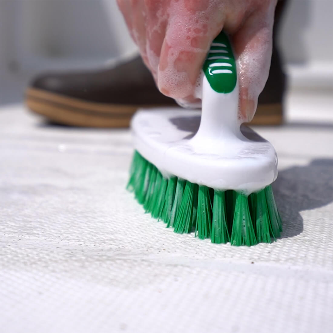 TotalBoat Boat Soap All Purpose Cleaner being used with a scrub brush