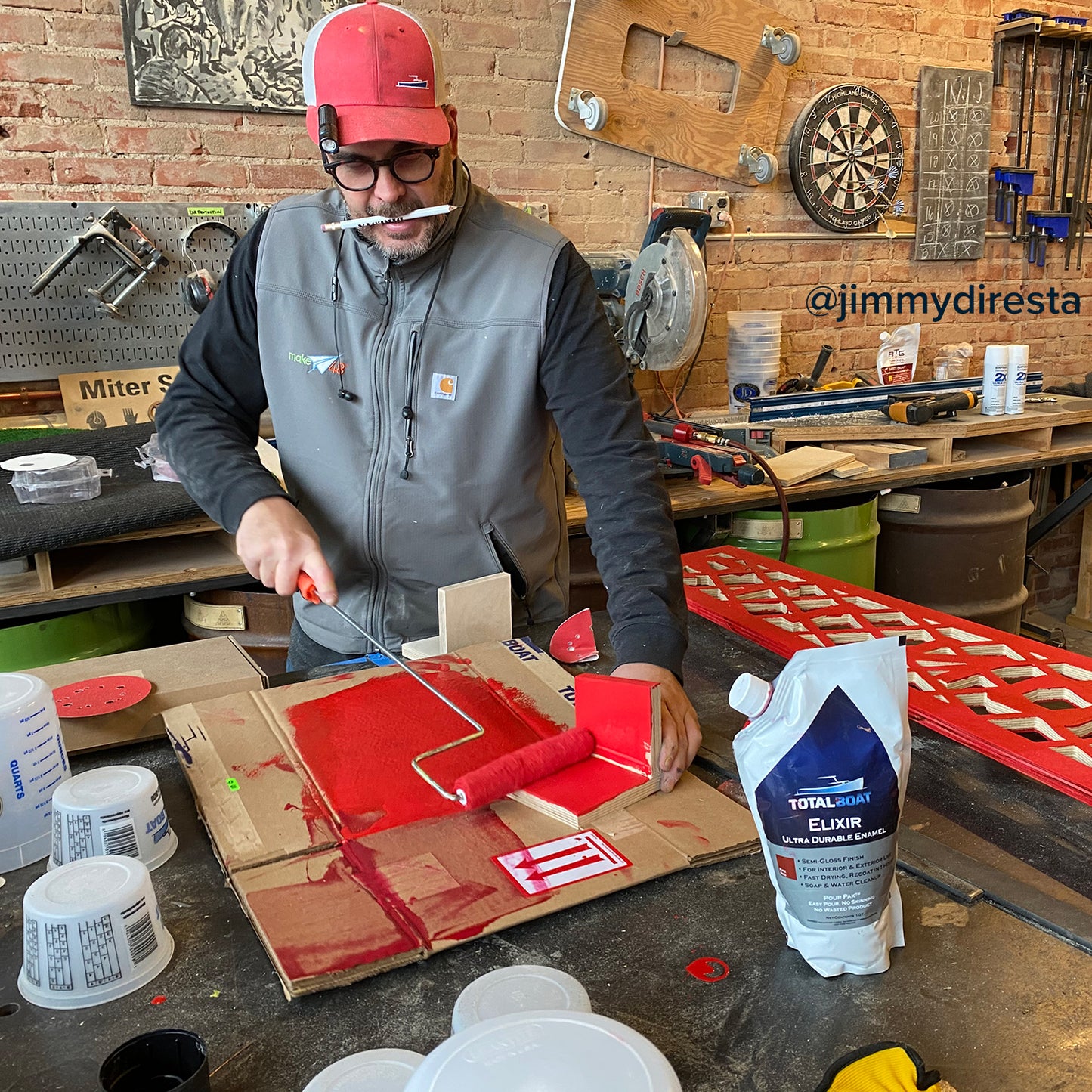 TotalBoat Elixir Enamel Topside Paint Red being applied with a roller by Jimmy Diresta on a project