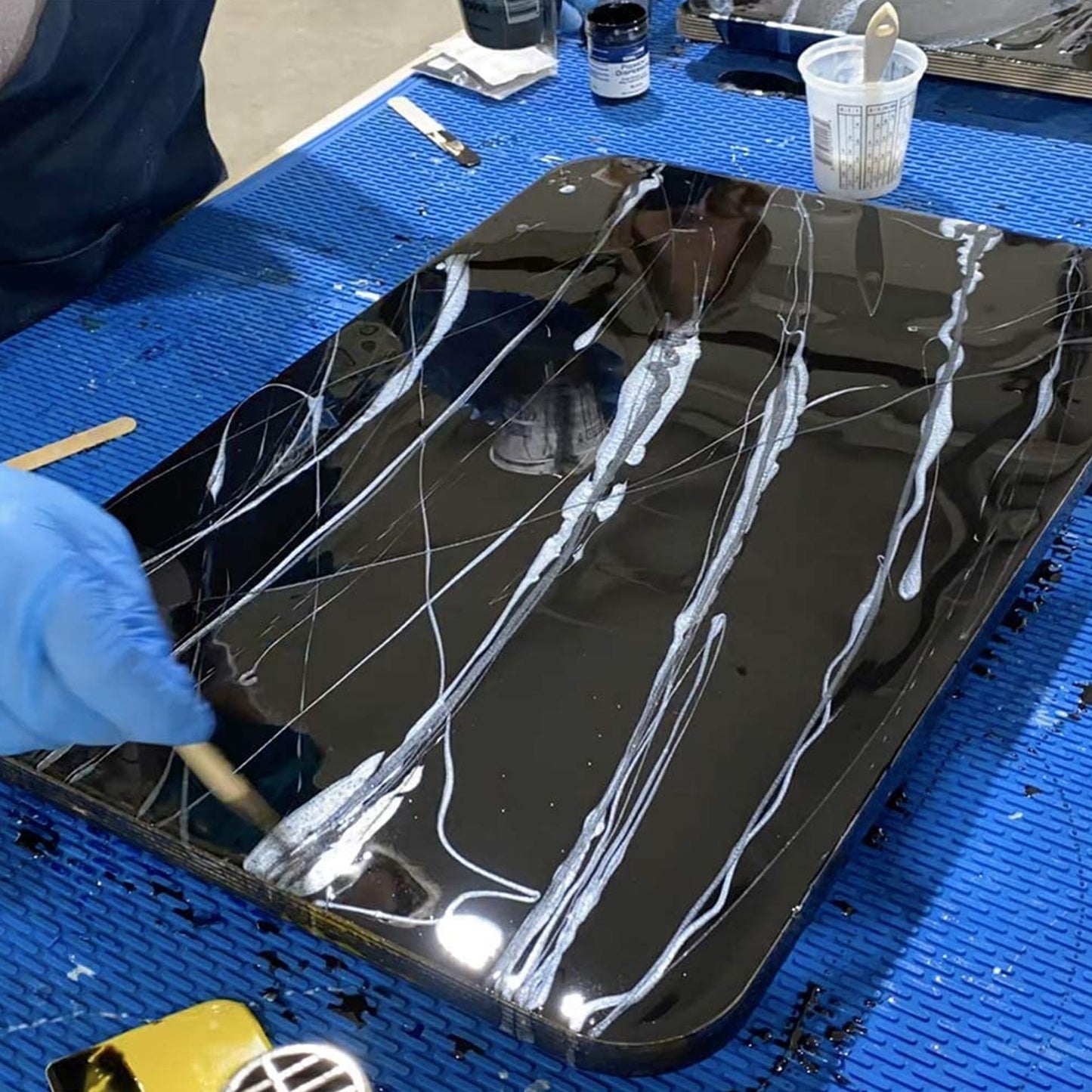 TotalBoat Epoxy Black Marble Effect Countertop Gallon Kit creating veins