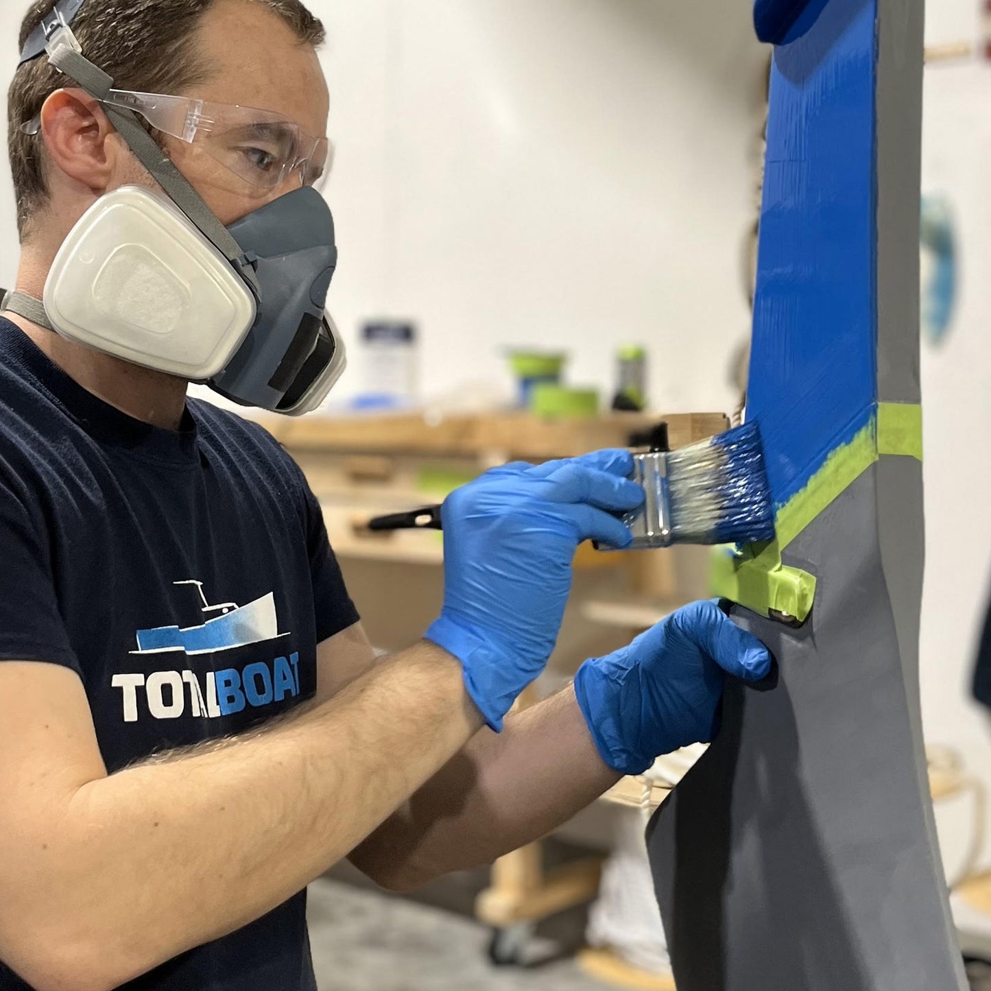 TotalBoat Wet Edge Topside Paint being brushed on a boat