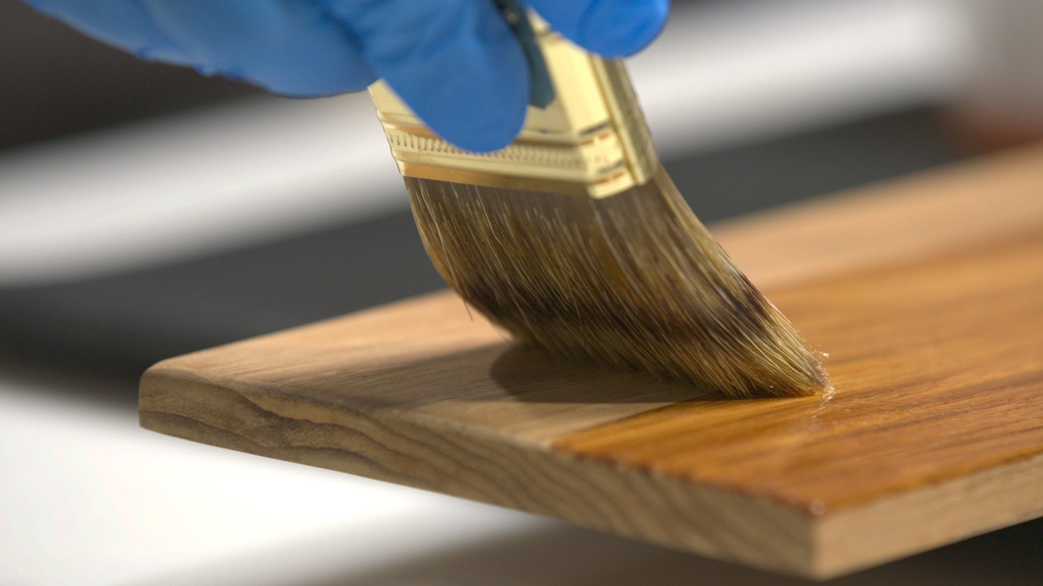 Gleam Varnish being brushed on wood
