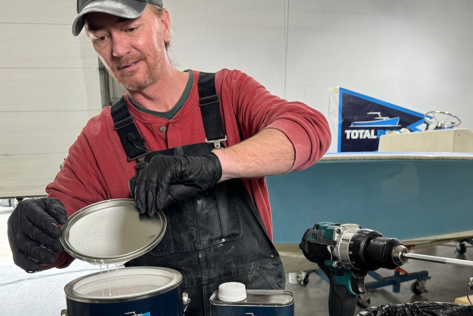 Andy Miller opening a can of paint