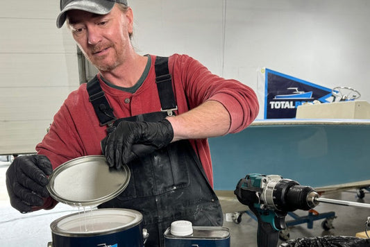 Andy Miller opening a can of paint