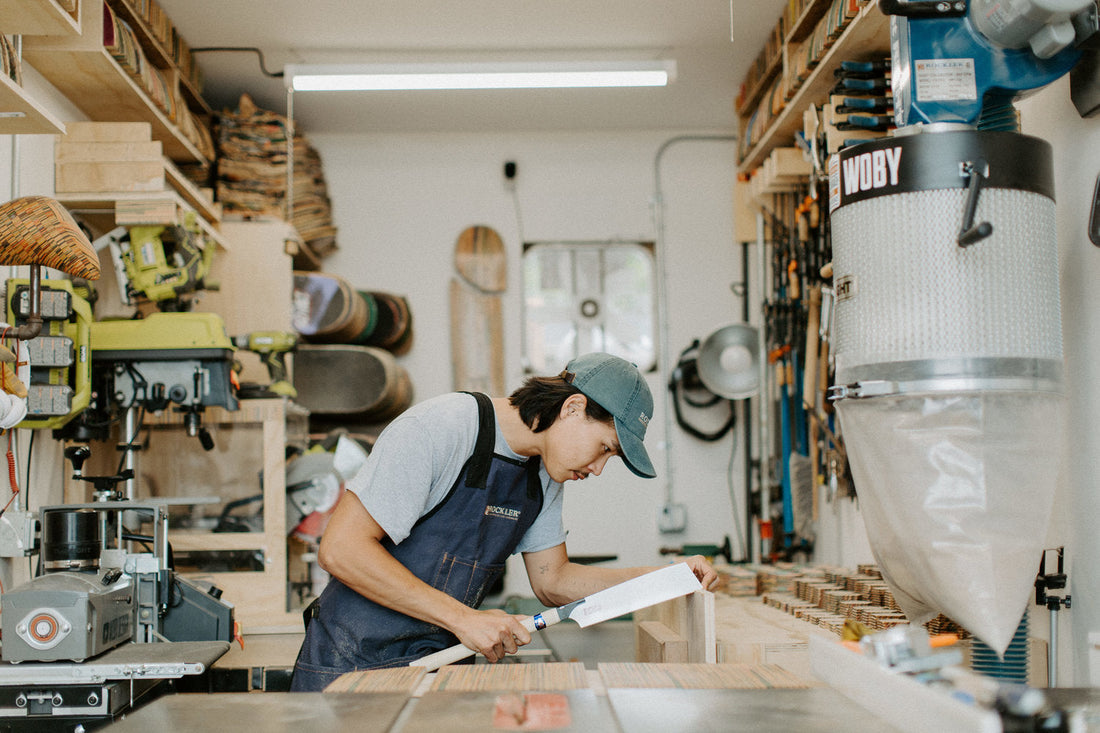 Ben from Woby Design in his workshop making art with recycled skateboards
