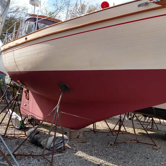 JD Select Water-Based Bottom Paint red on a boat