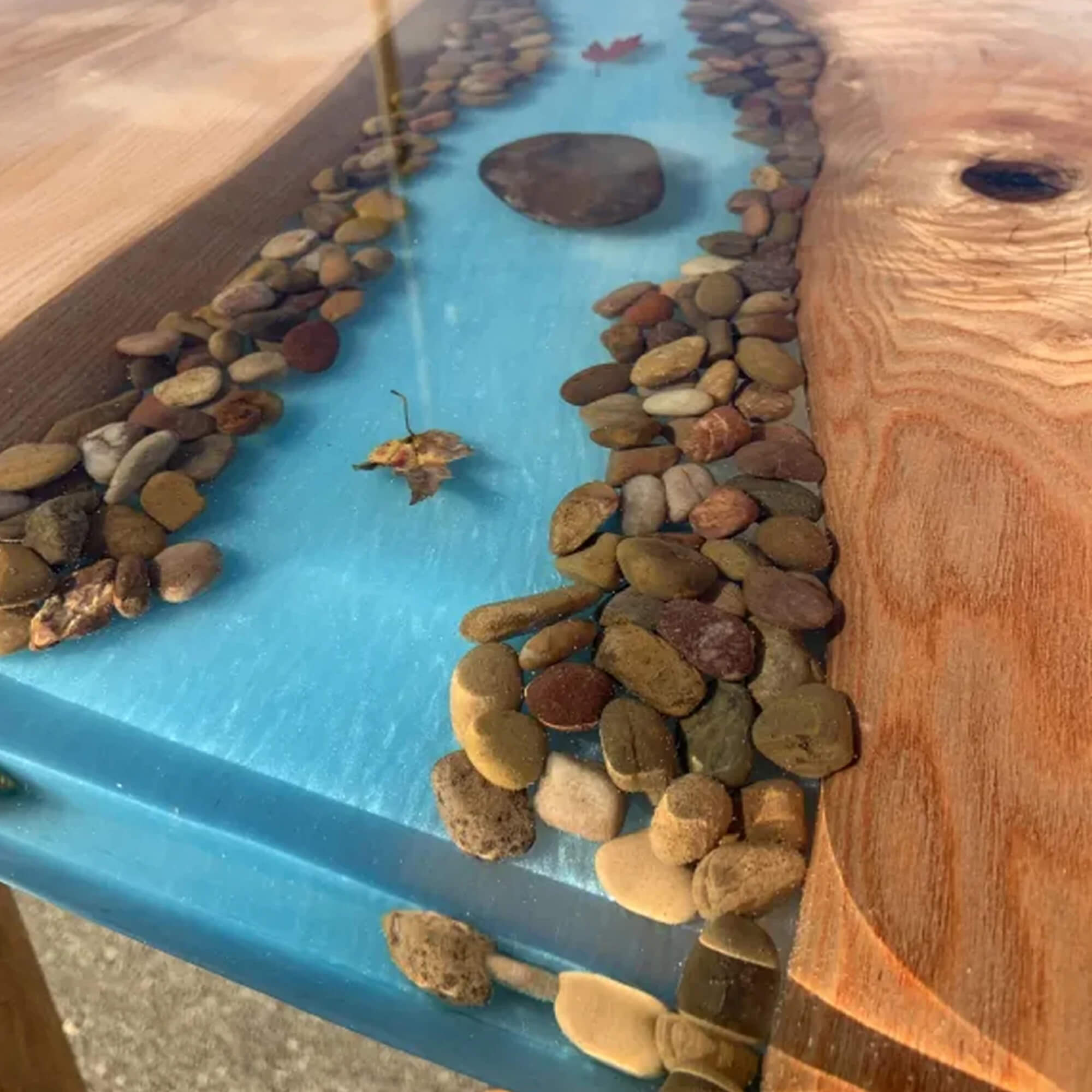 TotalBoat Thickset finished river table with stones