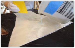 Pouring resin onto laminant