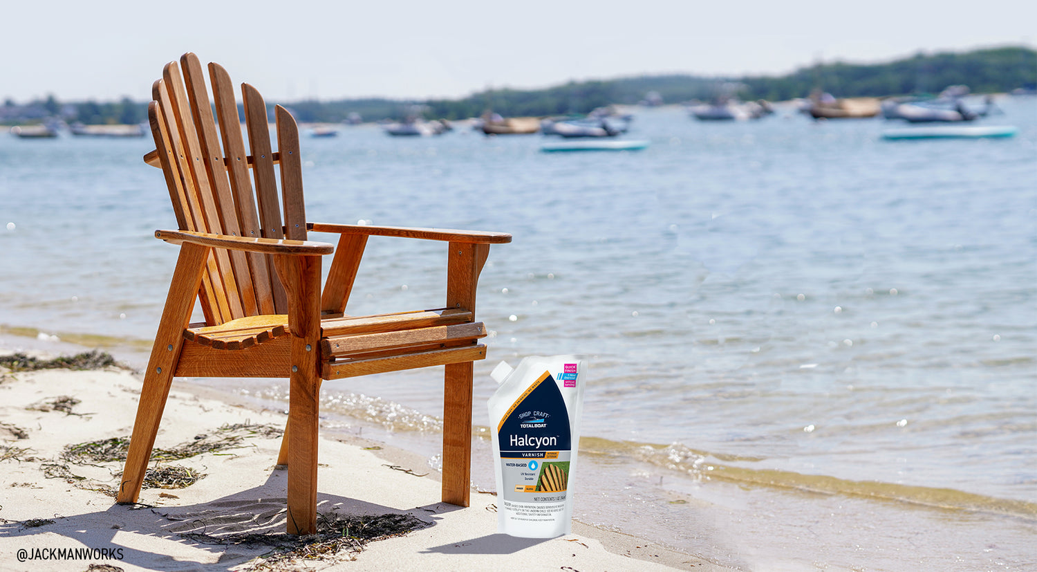 TotalBoat Halcyon Marine Varnish Shown with Wooden Adirondack Chair on Coastal Beach