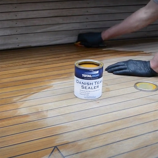 TotalBoat Danish Teak Sealer being applied to a boat deck