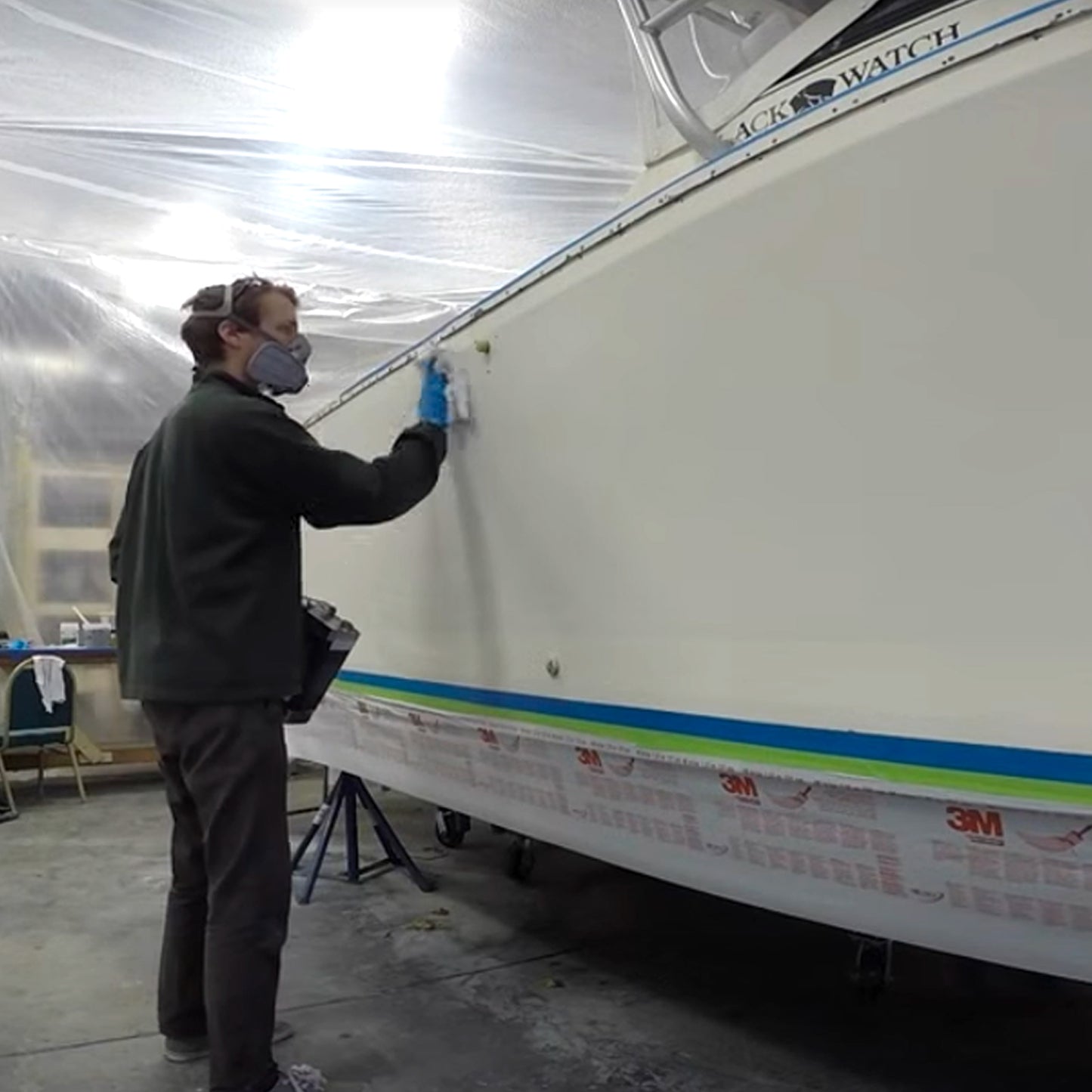 TotalBoat Dewaxer & Surface Prep Solvent being used on a boat