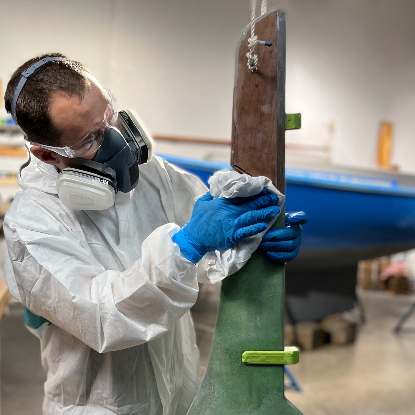 TotalBoat Dewaxer & Surface Prep Solvent being used on a boat