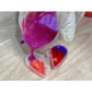 TotalBoat Epoxy Valentine Kit pouring tinted epoxy into the heart mold