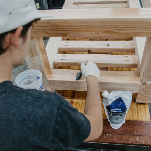 TotalBoat Halcyon Water-Based Marine Varnish clear gloss being applied to wood bench project