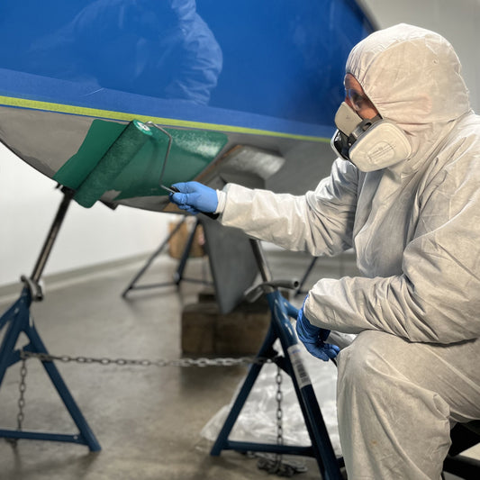 TotalBoat Spartan Multi-Season Antifouling Paint Green being applied with a roller