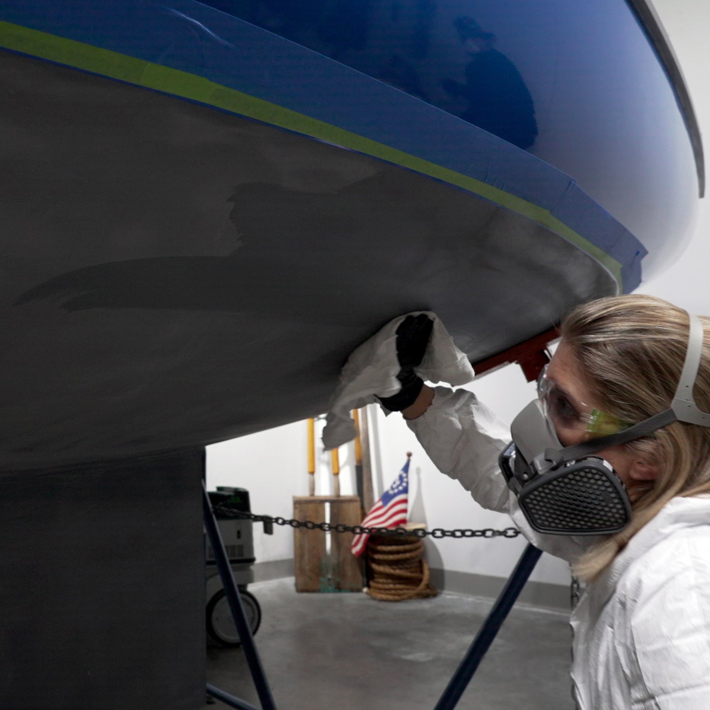 TotalBoat Special Brushing Thinner 100 being used on the bottom of a boat