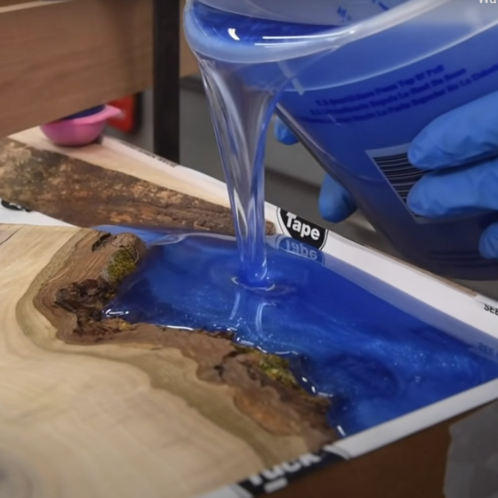 ThickSet Deep Pour Epoxy Resin tinted blue and being poured