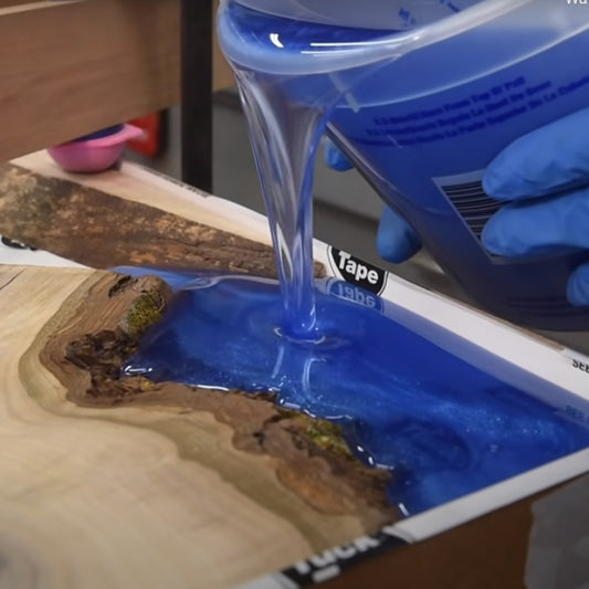ThickSet Deep Pour Epoxy Resin tinted blue and being poured