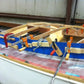 TotalBoat Thixo Cartridge Mixing Tips being used to repair a boat
