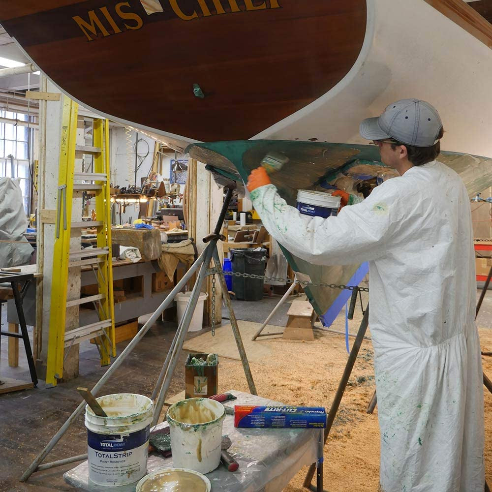 TotalBoat TotalStrip Paint Remover being used on the bottom of a boat