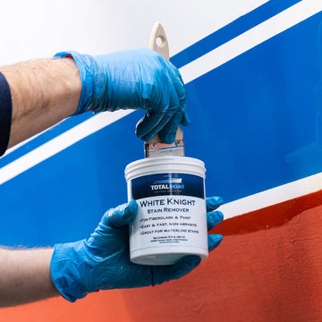 TotalBoat White Knight Fiberglass Stain Remover being applied to a brush