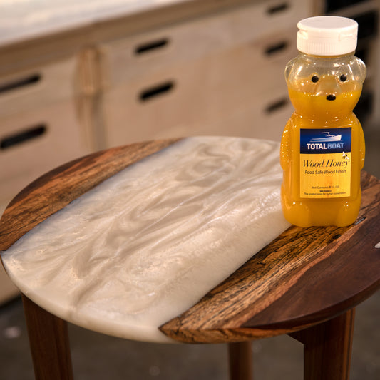 TotalBoat Wood Honey Food Safe Wood Finish used on a table