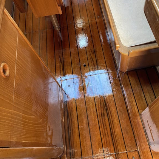 TotalBoat Wood Sealer Varnish Primer on a finished boat cabin floor